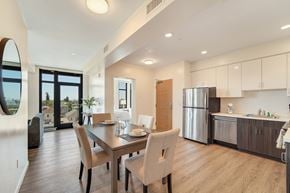 Berkeley apartment for rent - A modern kitchen with a dining table and chairs.