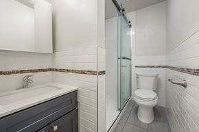Berkeley apartment for rent - A bathroom with a toilet, sink, and shower.