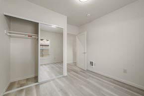 Berkeley apartment for rent - A white room with a sliding door and a white closet.
