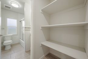 Berkeley apartment for rent - A white bathroom with a toilet and a walk in shower.