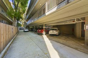 Berkeley apartment for rent - A parking garage with cars parked in it.
