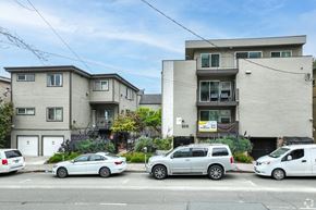 Berkeley apartment for rent - A row of houses with cars parked in front.
