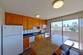 Berkeley apartment for rent - A kitchen with a refrigerator, stove, and sink.