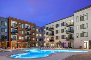 Aurora apartment for rent - A swimming pool in front of apartment buildings.