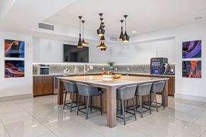 Chandler apartment for rent - a large kitchen with a bar and chairs