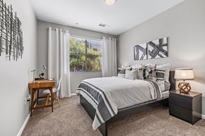 Englewood apartment for rent - an attic bedroom with a bed and a window