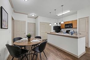Austin apartment for rent - A kitchen with a dining table set for four.