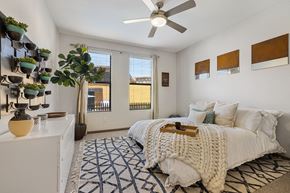 Phoenix apartment for rent - a bedroom with a bed and a ceiling fan