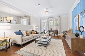 Mooresville apartment for rent - A living room with a white couch and a rug.