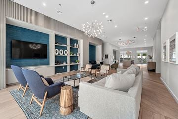 Austin apartment for rent - a living room with couches and chairs and a television