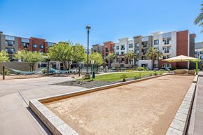 Chandler apartment for rent - the preserve at ballantyne commons courtyard with playground and apartment buildings