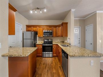 Cave Creek apartment for rent - a kitchen with granite counter tops and stainless steel appliances