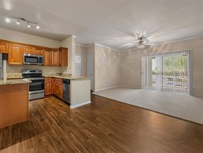 Cave Creek apartment for rent - an empty kitchen and living room with a sliding glass door