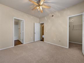 Cave Creek apartment for rent - a bedroom with a ceiling fan and a door to a closet