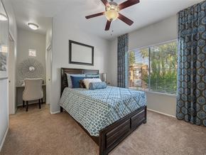 Chandler apartment for rent - a bedroom with a bed and a ceiling fan
