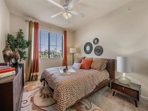 Phoenix apartment for rent - a bedroom with a bed and a ceiling fan