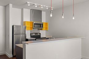 Seattle apartment for rent - a kitchen with a counter top and a refrigerator