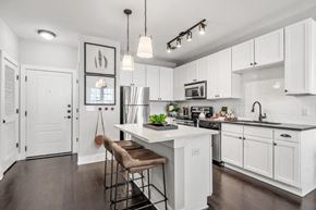 Atlanta apartment for rent - a kitchen with white cabinets and a white counter top
