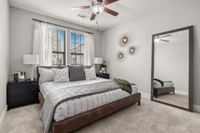 Atlanta apartment for rent - a bedroom with a bed and a ceiling fan