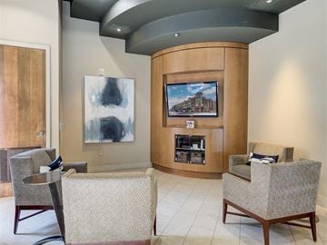 Lone Tree apartment for rent - A living room with a television and a painting on the wall.