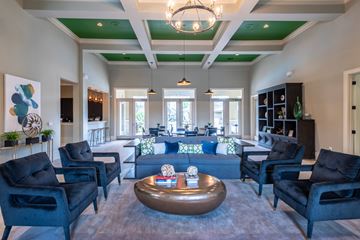 Katy apartment for rent - A living room with black chairs and a coffee table.