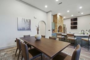 San Antonio apartment for rent - A dining room with a wooden table and chairs.