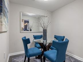 Atlanta apartment for rent - a dining room with blue chairs and a table