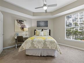 Atlanta apartment for rent - a bedroom with a bed and a ceiling fan