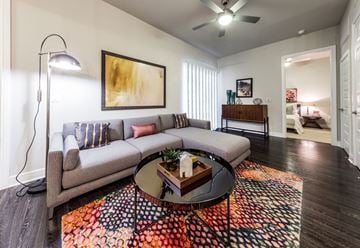 Houston apartment for rent - a living room with a couch and a table