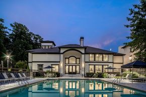 Atlanta apartment for rent - A large house with a pool in front.