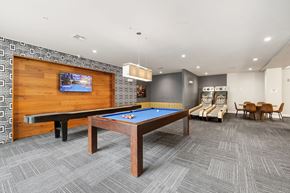 Houston apartment for rent - A room with a pool table and a television.
