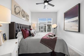 Nashville apartment for rent - a bedroom with a bed and a ceiling fan