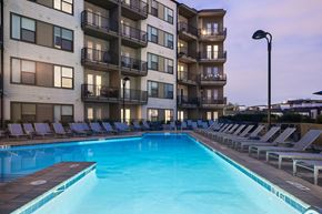 Nashville apartment for rent - a large swimming pool in front of an apartment building
