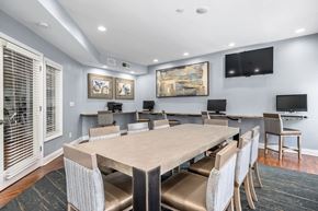 Atlanta apartment for rent - A dining room with a large table and chairs.