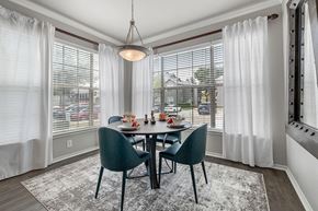 Flower Mound apartment for rent - A dining room with a table set for four.