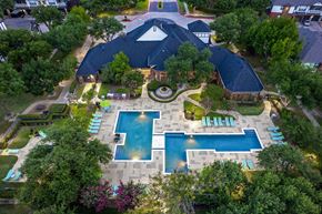 Frisco apartment for rent - A large backyard with a pool and a deck.