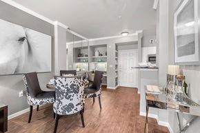 Dallas apartment for rent - A modern dining room with a large table and chairs.