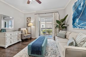 Houston apartment for rent - A bedroom with a blue blanket on the bed.