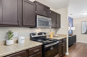 Morrisville apartment for rent - a kitchen with stainless steel appliances and granite counter tops