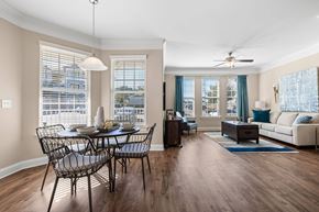 Durham apartment for rent - A modern dining room with a glass table and chairs.