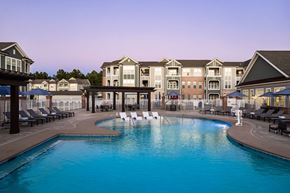 Durham apartment for rent - A large swimming pool in front of a resort.