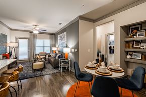 Katy apartment for rent - a living room with a table and chairs in front of a couch