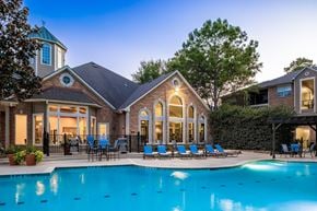 Kingwood apartment for rent - A large house with a pool in the backyard.