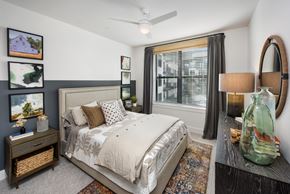 Norcross apartment for rent - a bedroom with a bed and a large window