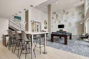 Austin apartment for rent - A modern dining room with a glass table and chairs.
