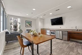 Austin apartment for rent - A modern kitchen with a dining table and chairs.