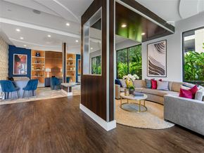 Austin apartment for rent - A modern living room with a wooden floor and a grey sofa.