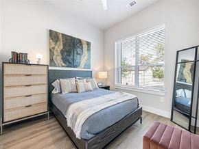 Austin apartment for rent - a bedroom with a bed and a window