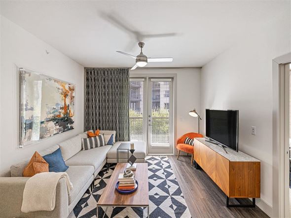 Dallas apartment for rent - a living room with a couch and a tv