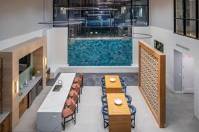 Austin apartment for rent - A modern dining area with a long table and chairs.